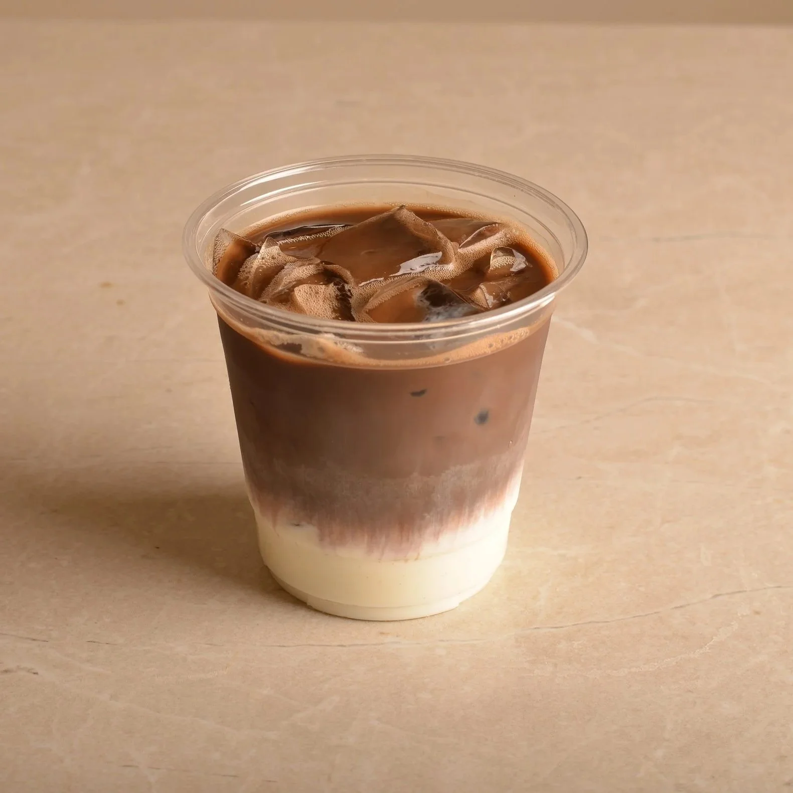 Iced hojicha with milk over ice — Japanese roasted green tea drink