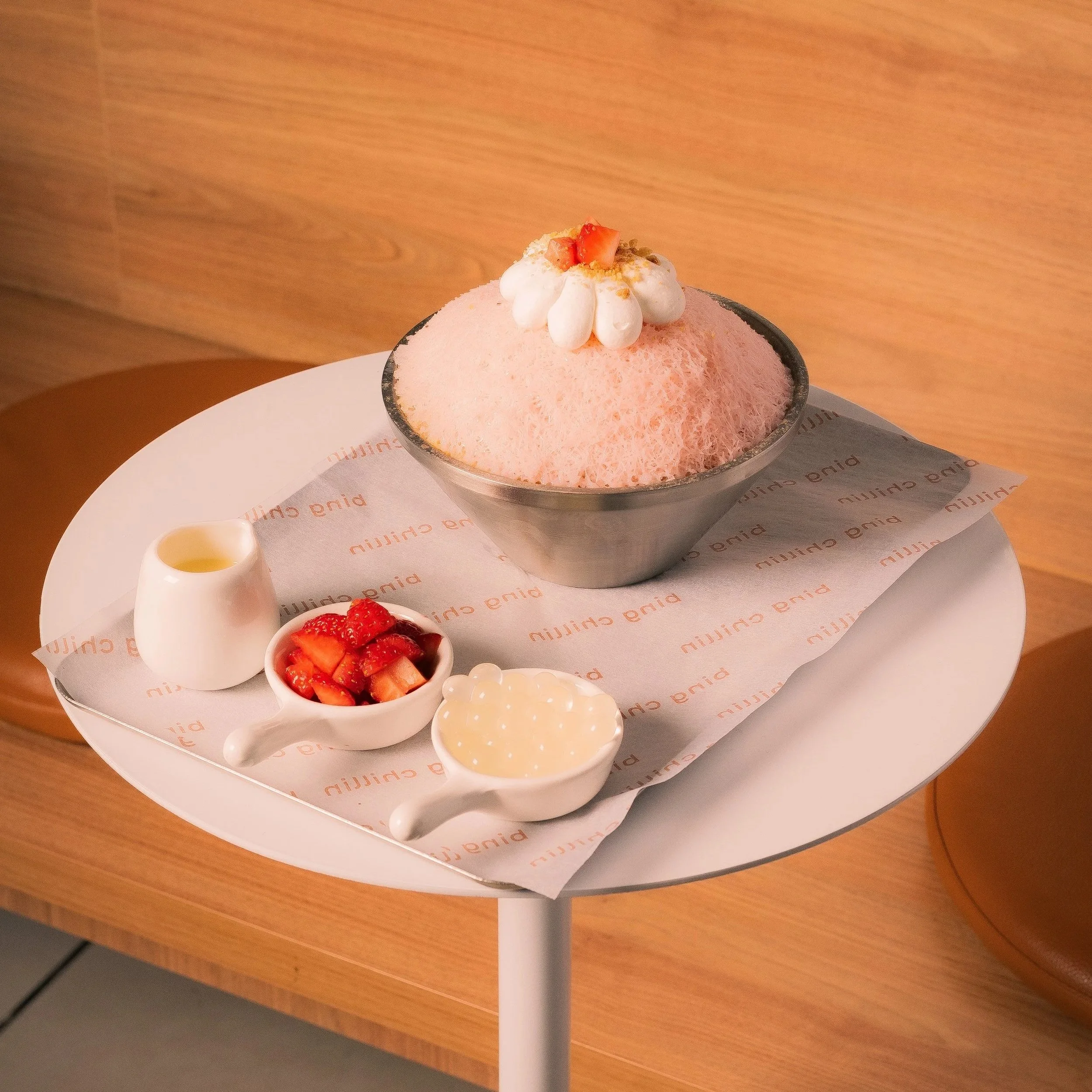 Strawberry bingsu — strawberry shaved ice with condensed milk, fresh strawberries and lychee popping pearls
