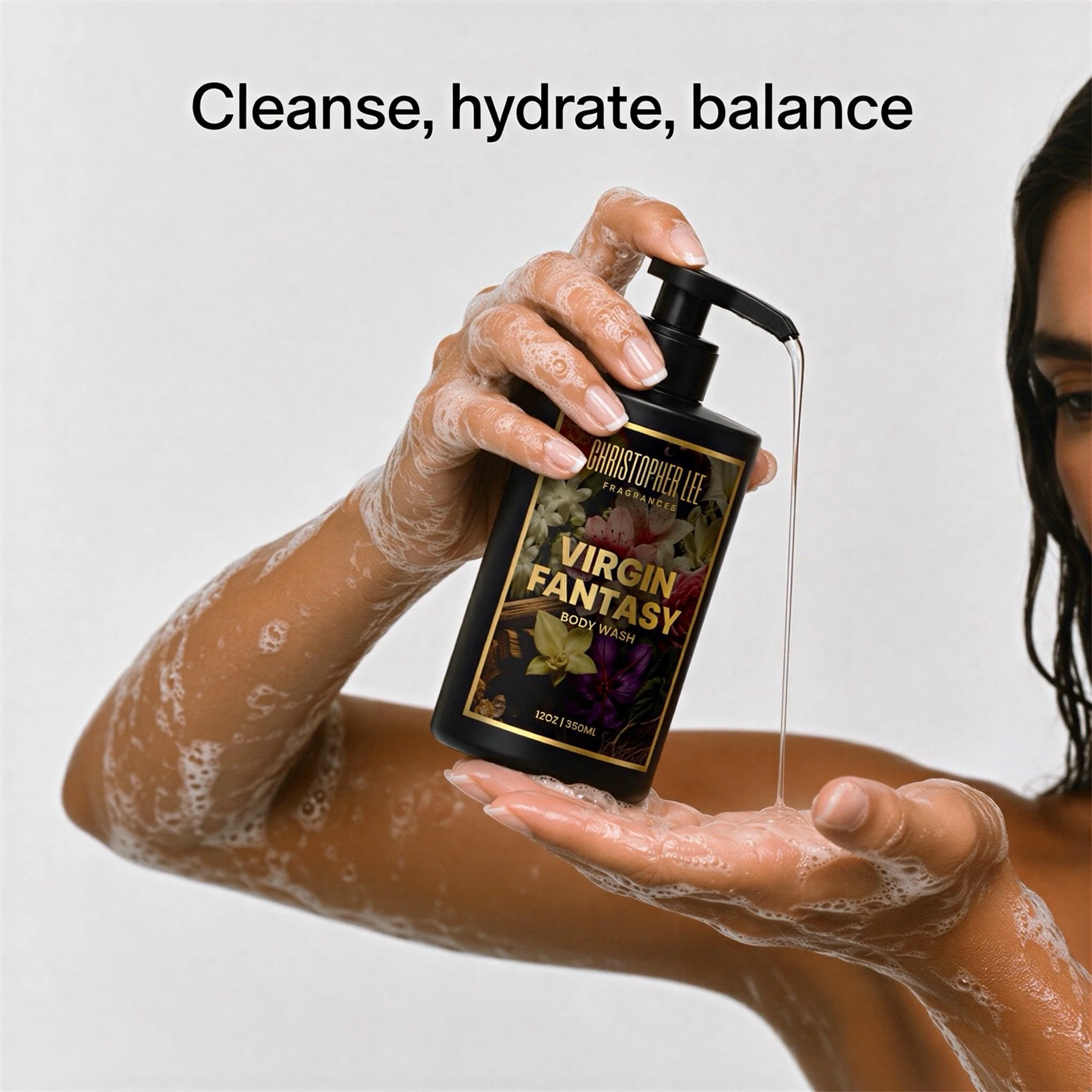 A hand holding a bottle of Christopher Lee fragrance body wash, with soap suds on the hand. The background displays the words 'Cleanse, hydrate, balance'.