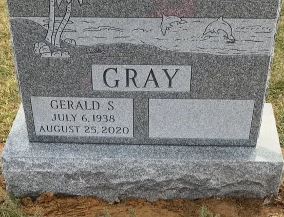 headstone highlighting a panel for each name