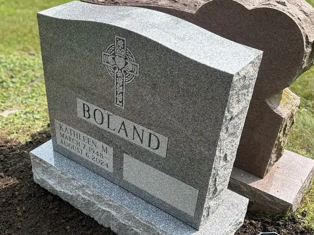 headstone with a polished top and rocky sides