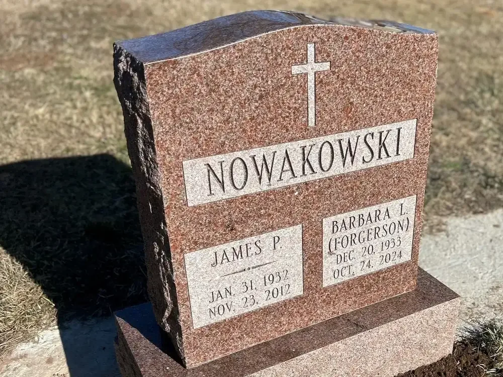 headstone with a polished top and rocky sides