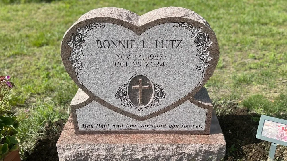 Heart shaped headstone with a cross