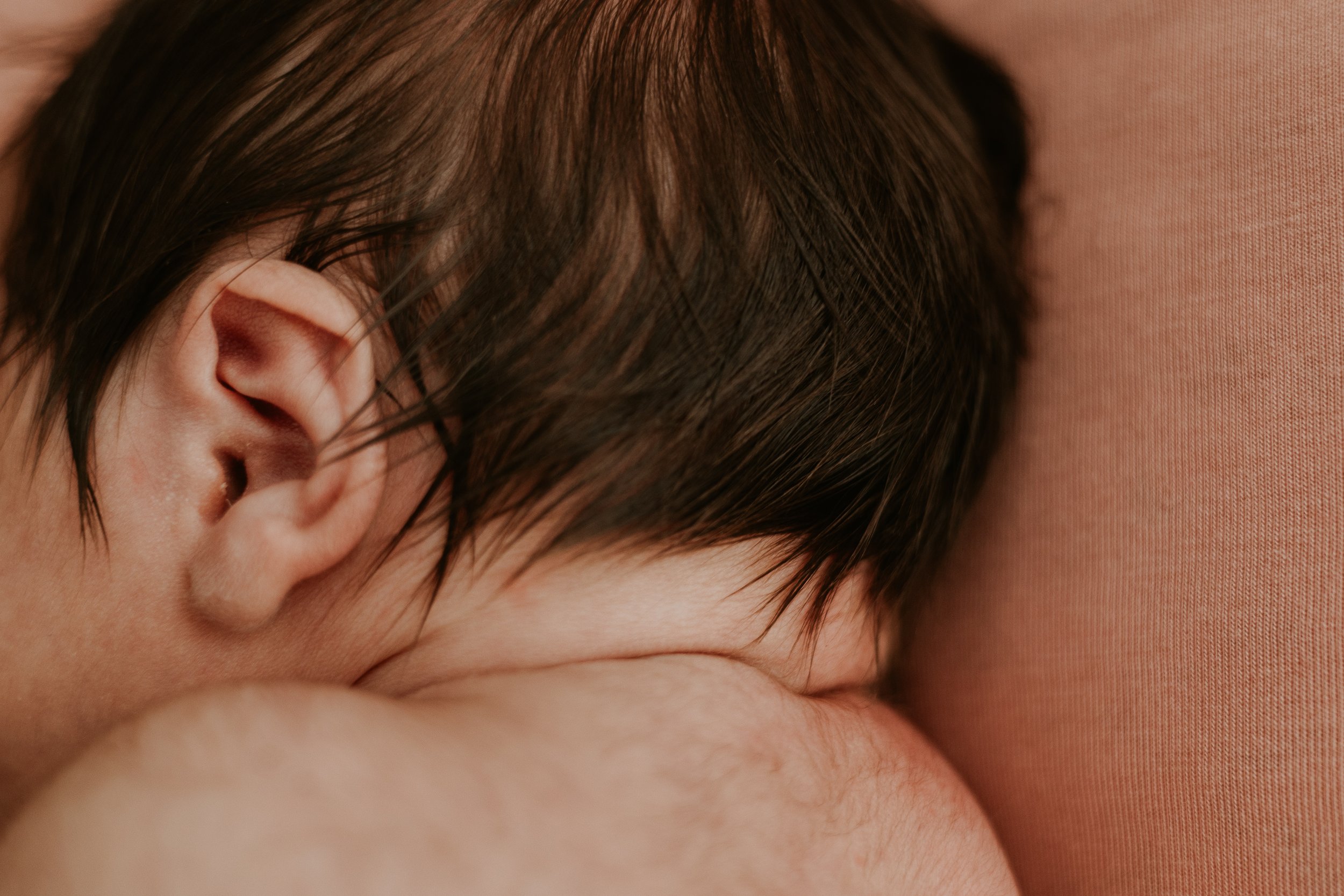 This baby was born with a lot of long, dark hair.