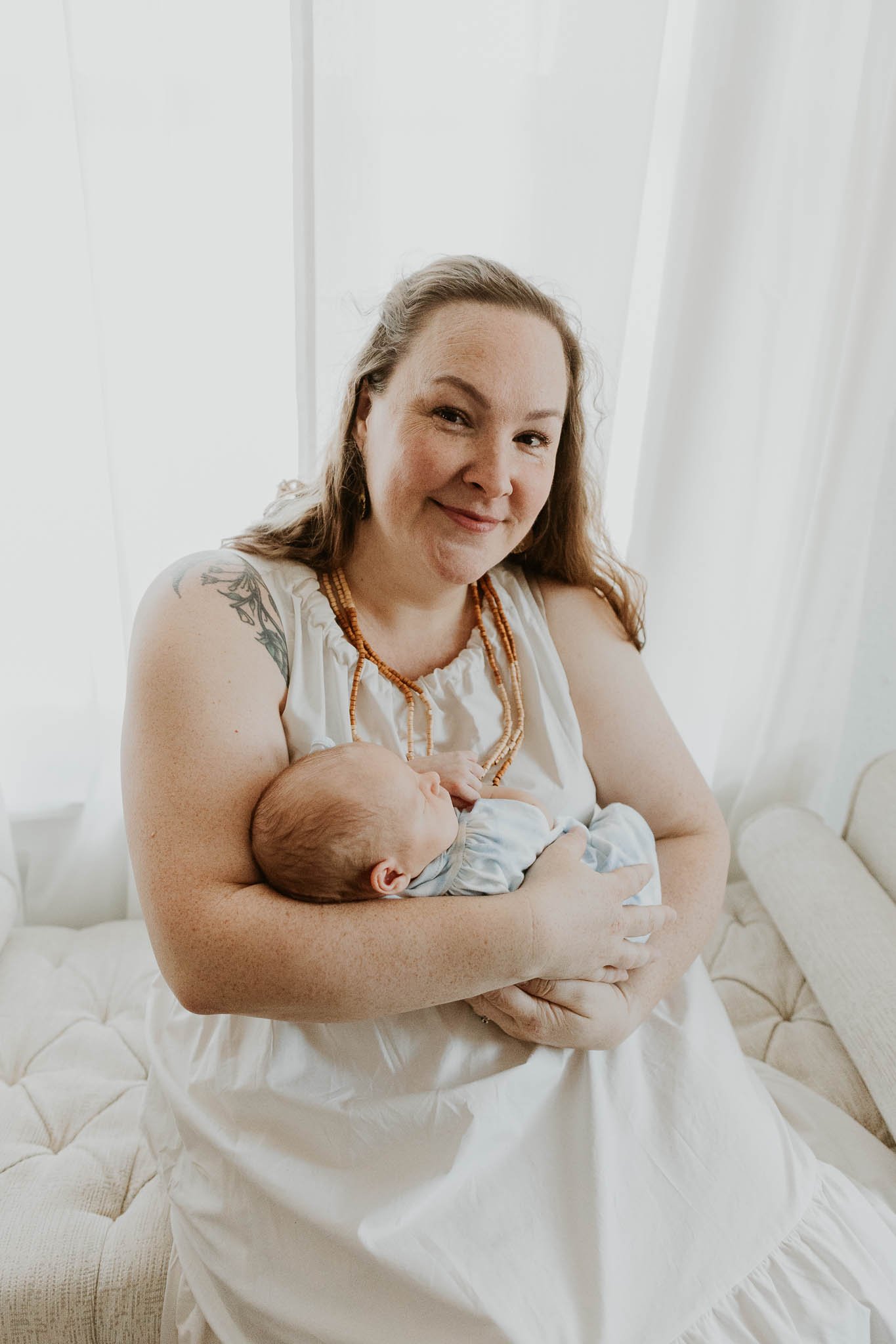 A mother with her newborn daughter during their photoshoot with Liz Walsh of Bloomington, Illinois.