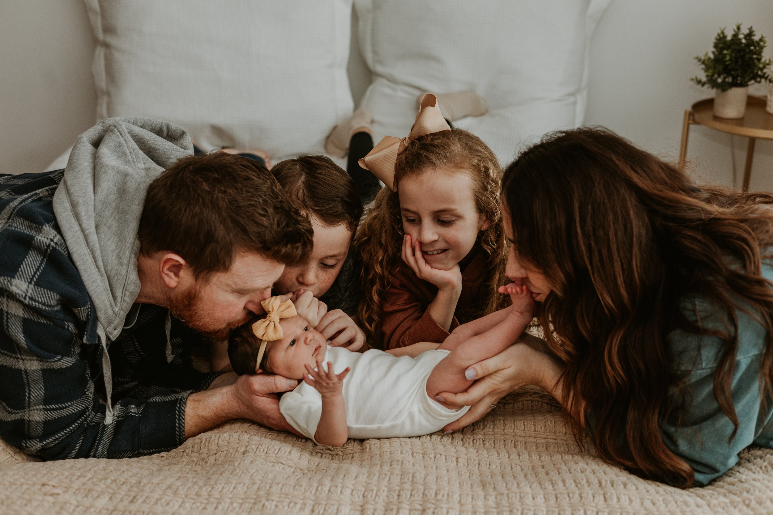 Tender kisses for baby from everyone in the family.