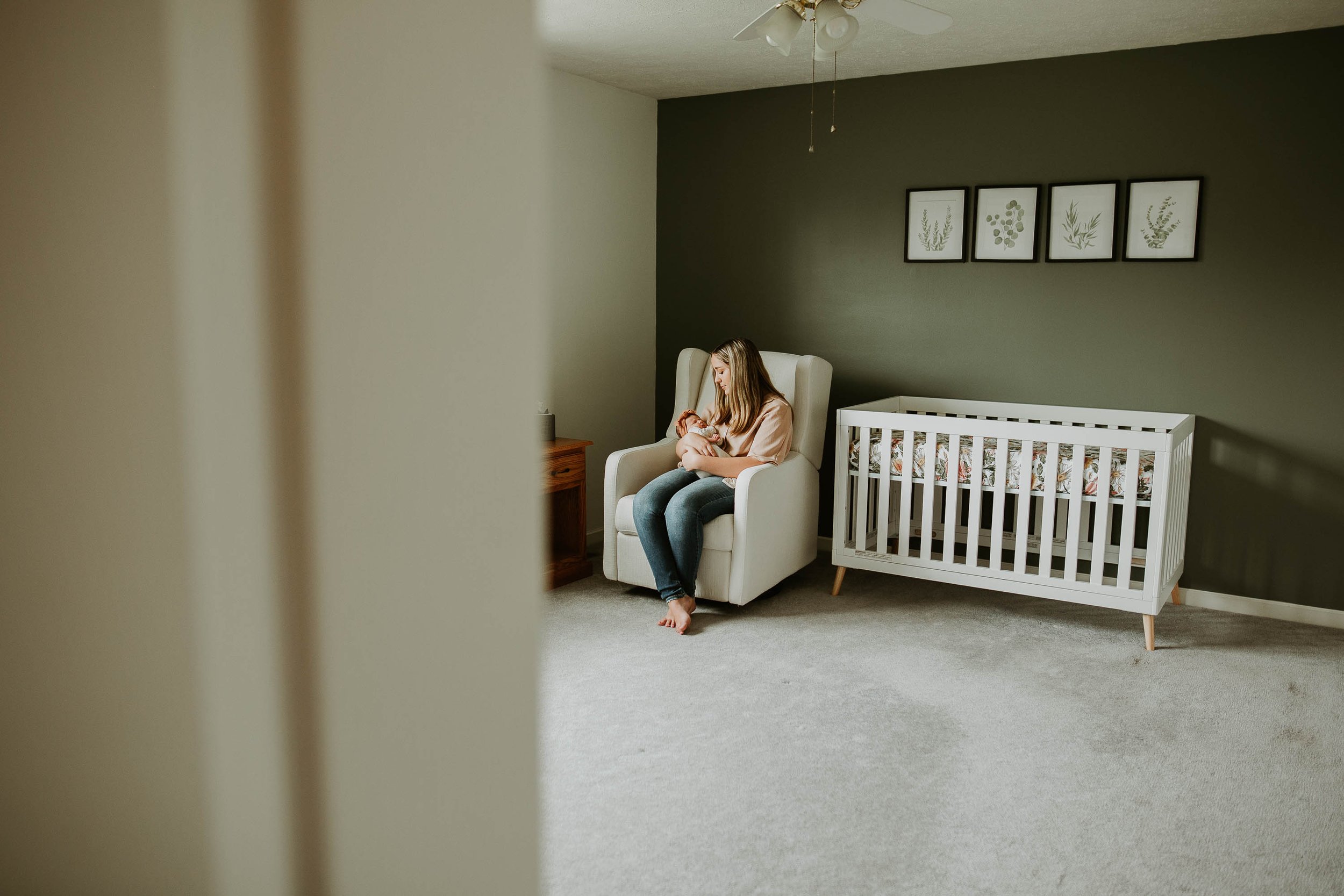 Simple moments of mom studying her baby are part of the process of our newborn session.