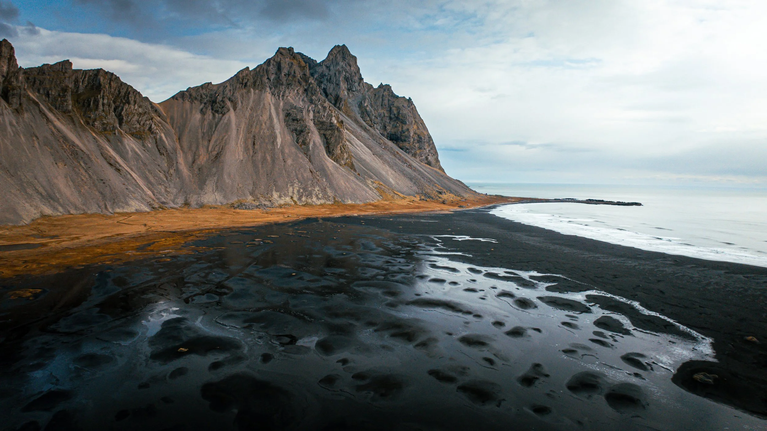 A drone view of the Stokksnes beach with the majestic Vestrahorn Mountain
