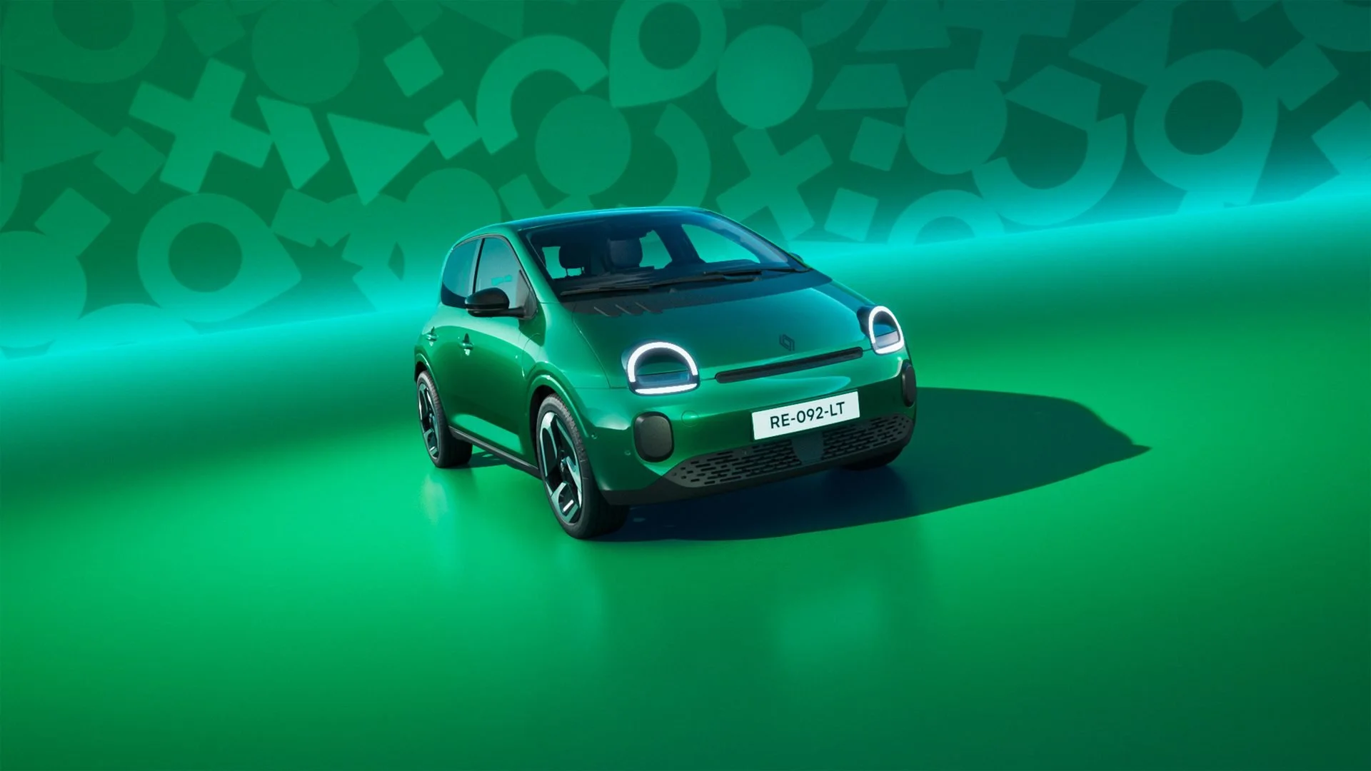 Renault Twingo E-Tech 100% elétrico verde, vista frontal a três quartos em estúdio