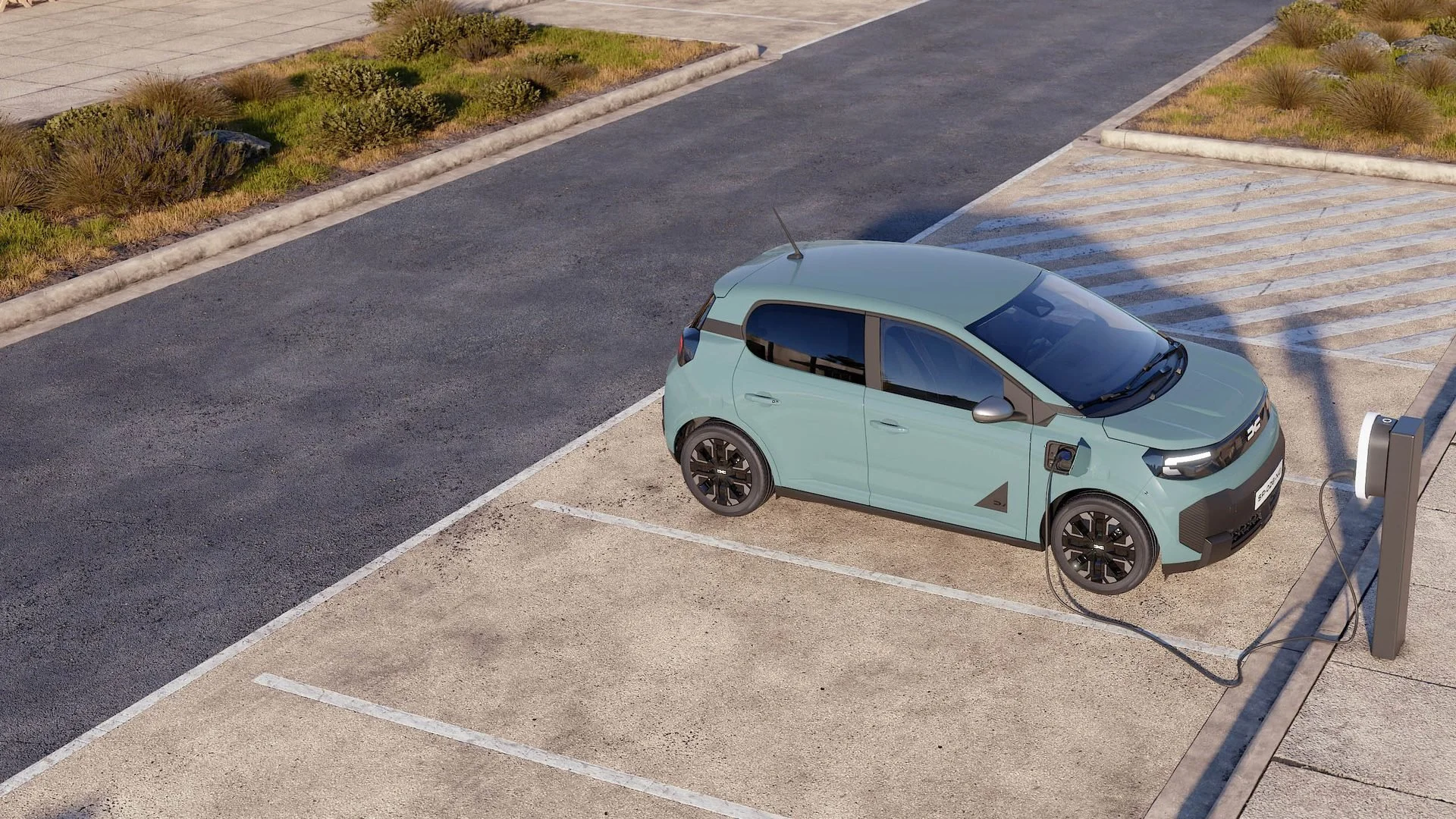 Novo Dacia Spring visto de cima a carregar num posto de carregamento num parque de estacionamento