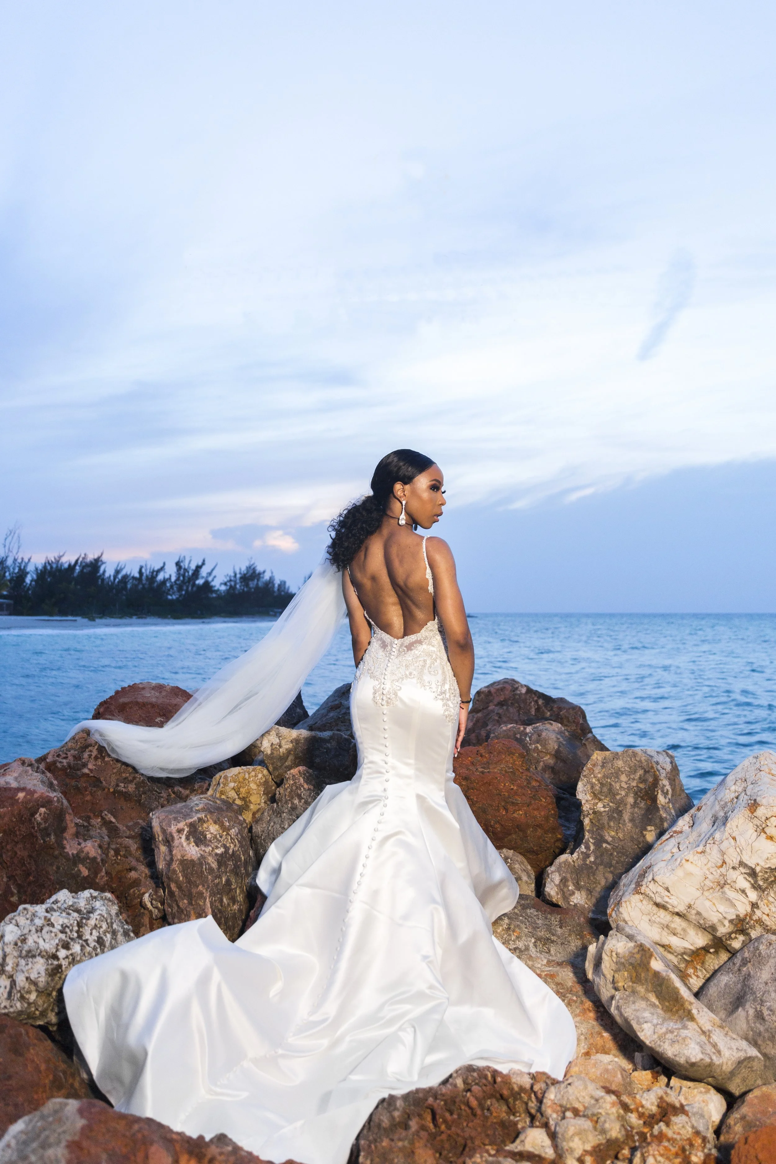 Laurie’s customers, Fernando and Kate embracing by the lake on their wedding day.