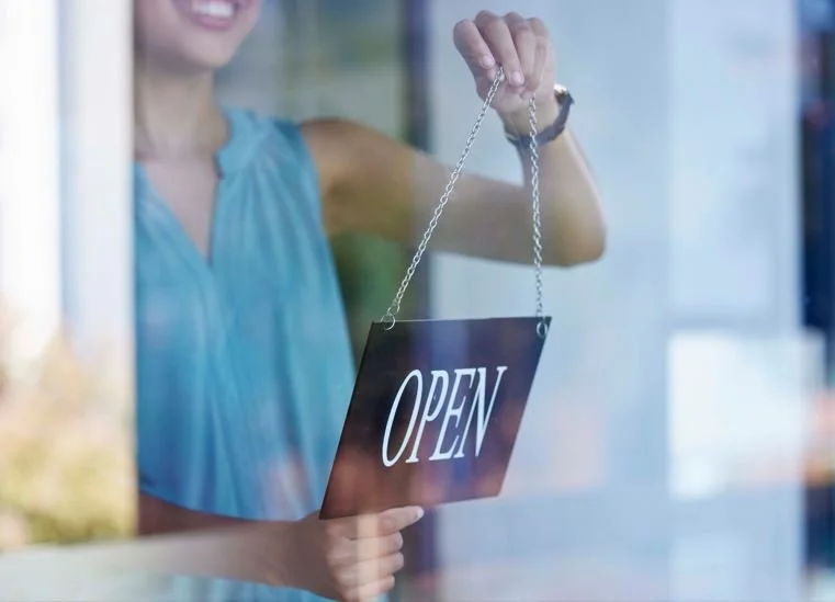 turning the open sign at Hilton Head Island business