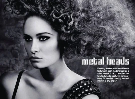 Black and white image of a model with voluminous curly hair, wearing a studded garment. Text reads "metal heads" with a description of the hair styling technique used.