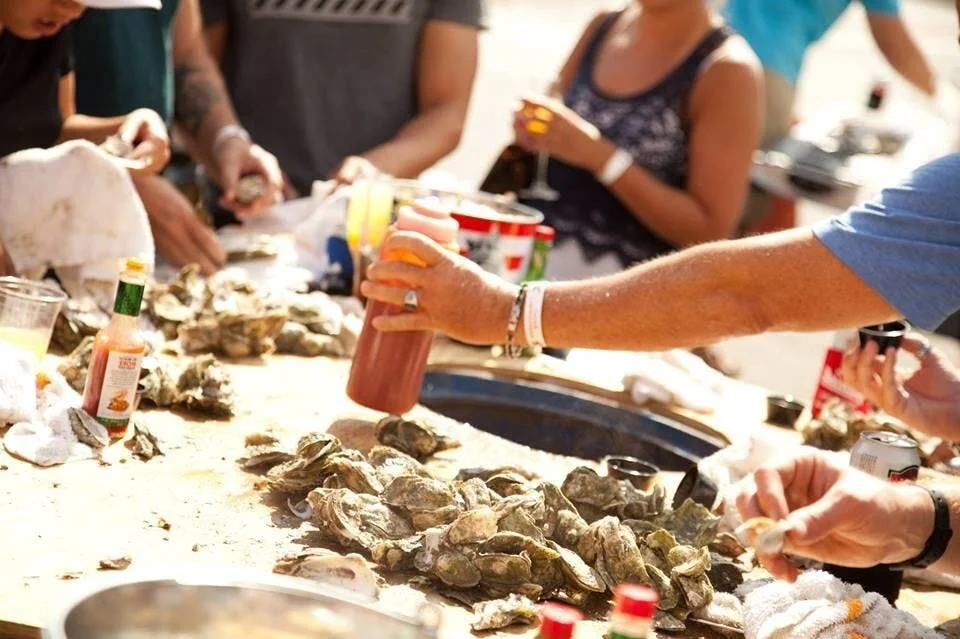 people shucking oysters in Hilton Head Island, SC
