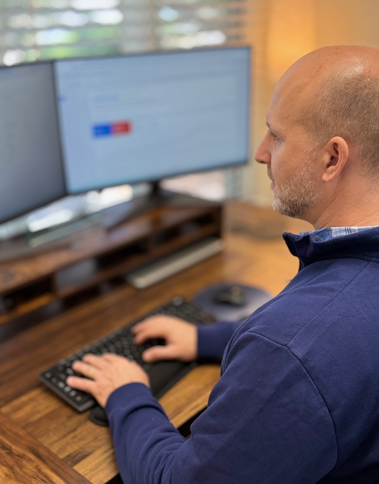 Mike Tucker at marketing desk