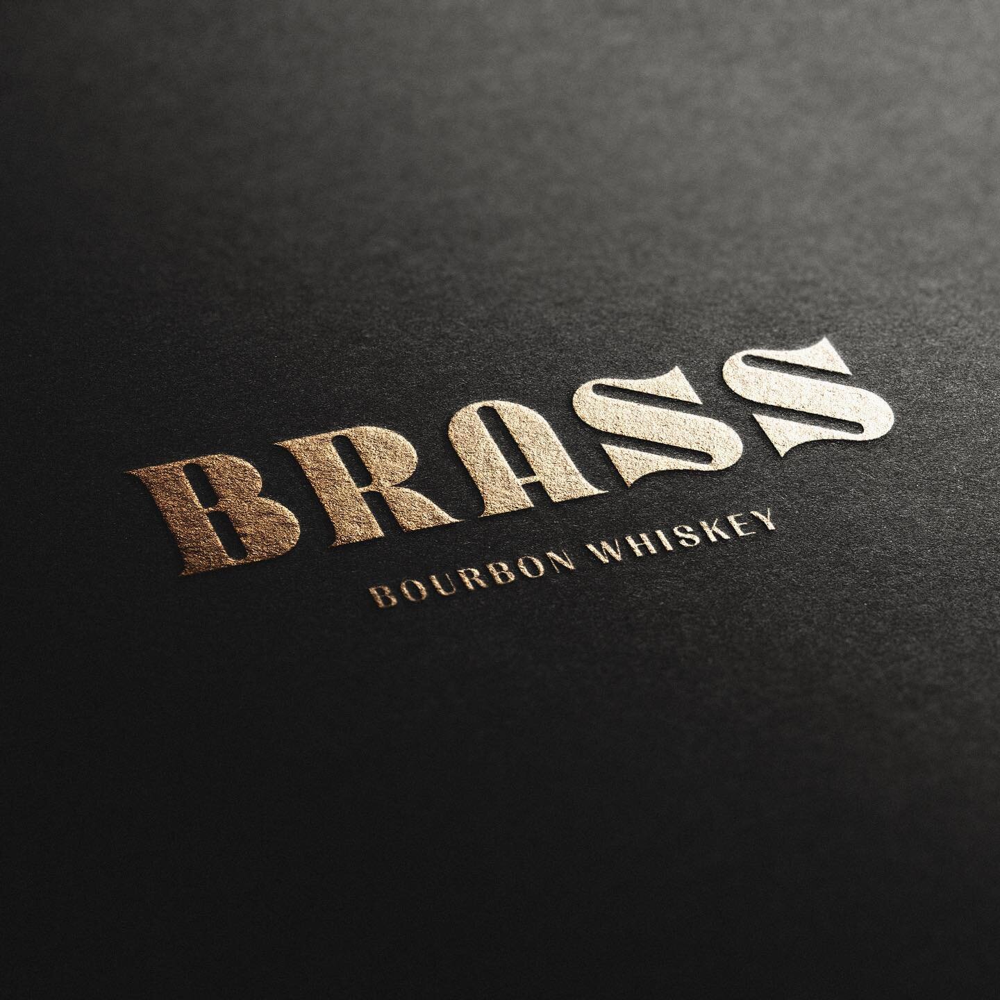 Close up of the Brass Bourbon logo design. We really got to geek out on type with this mark 🤓. We were inspired by the shape language and boldness of brass instruments 🎺, so we crafted the custom typography to embody that aesthetic. The logo became