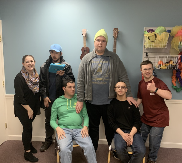 Adults with developmental disabilities in a music therapy group session at The Sonatina Center