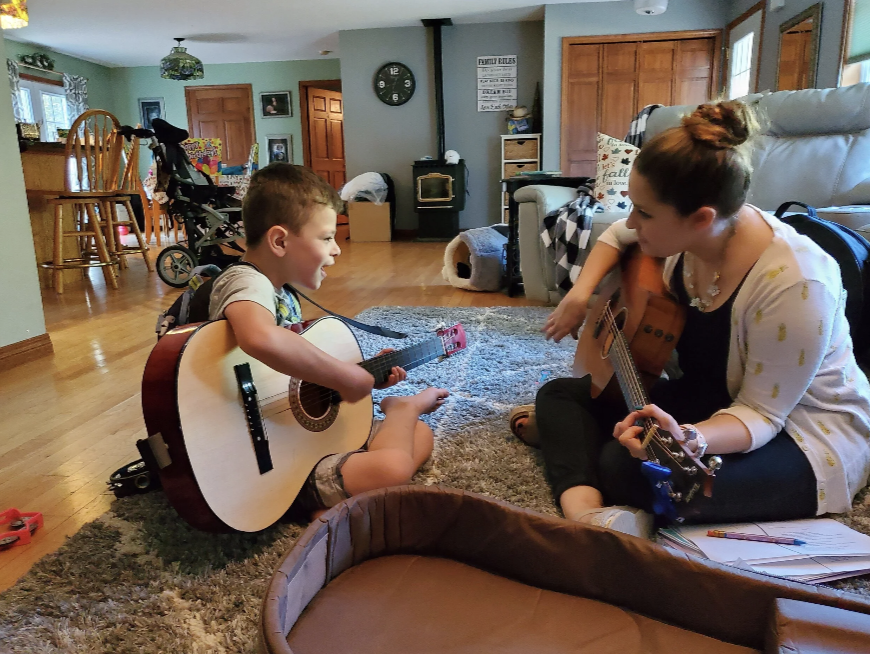 Music therapist building rapport with a client during an individual music therapy session