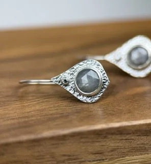 Mini Opulence Earrings- Silver Sapphire close up lying flat.jpeg