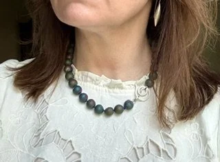 Northern Lights Necklace with rainbow druzy quartz worn on model.