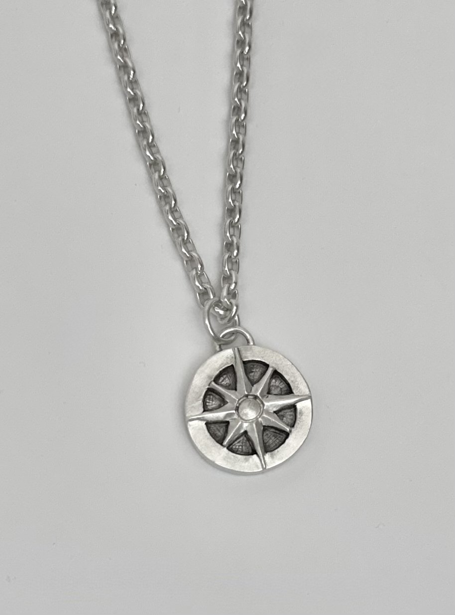 Artisan sterling silver compass pendant by KFinn Designs, hand carved in wax and cast in sterling silver with a hand-applied oxidized finish