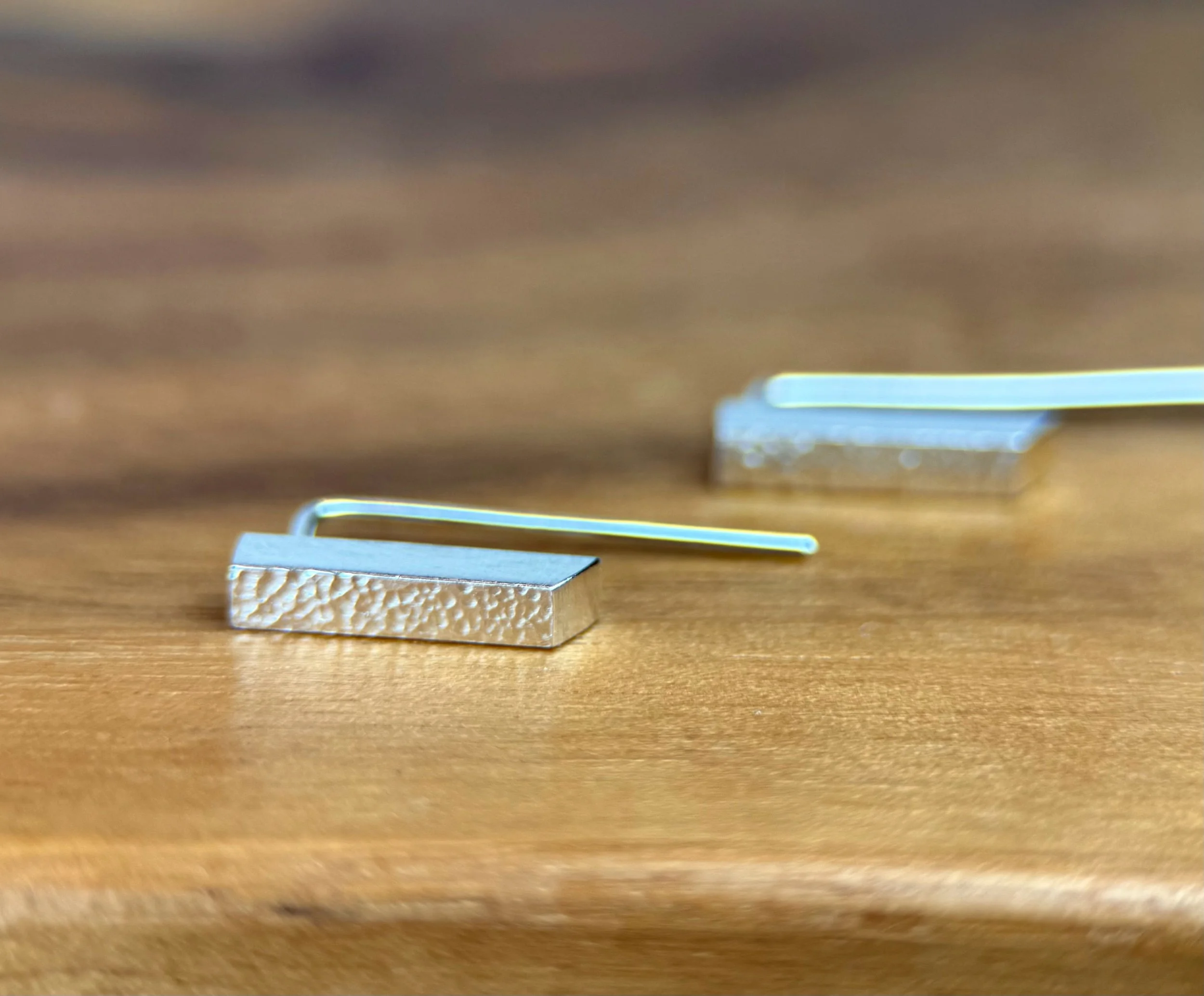 Minimalist sterling silver Modern Stud Earrings with clean geometric lines and hand-textured finish, handcrafted by KFinn Designs.