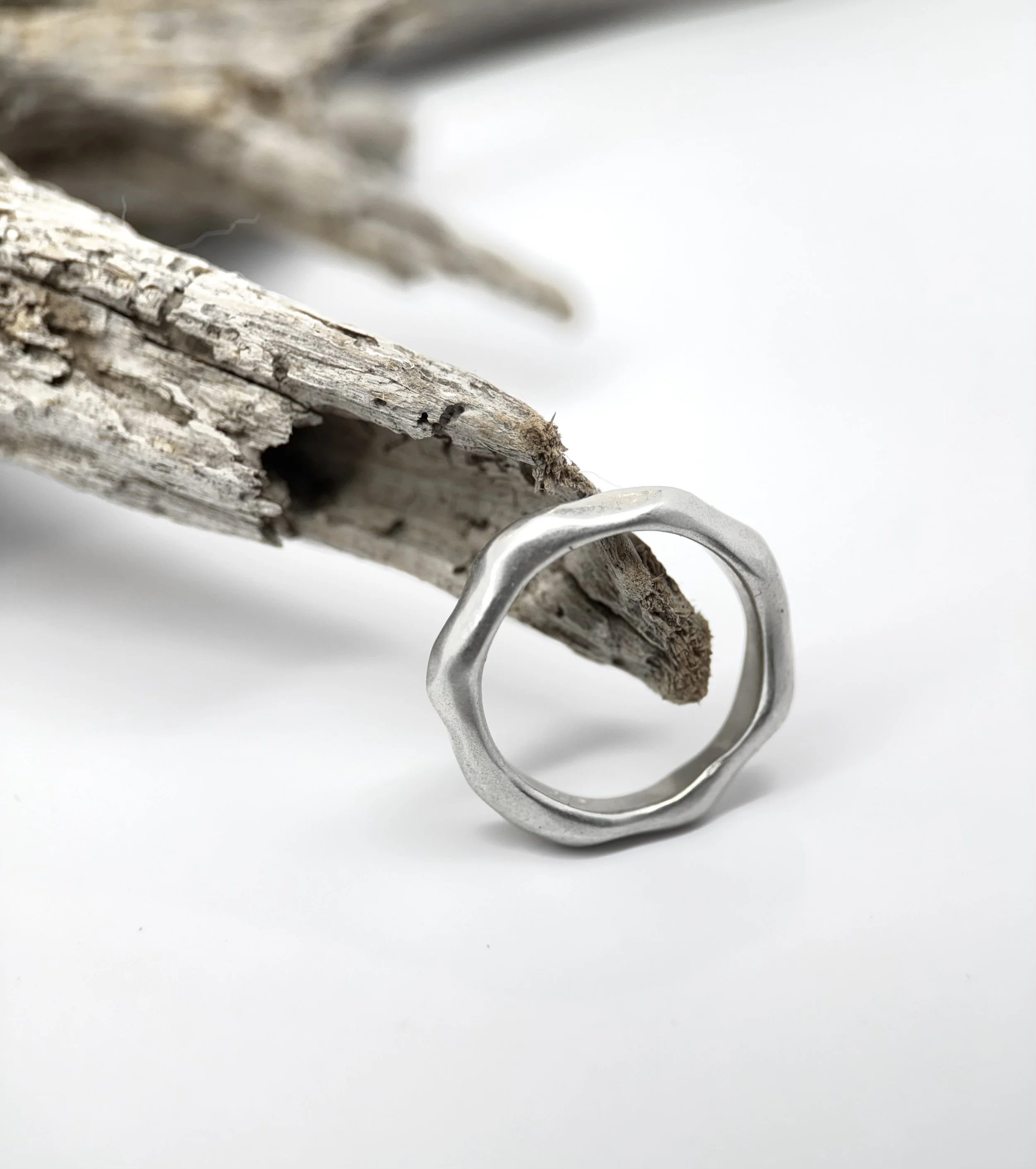 Handcrafted sterling silver organic band ring with smooth, softly undulating edges