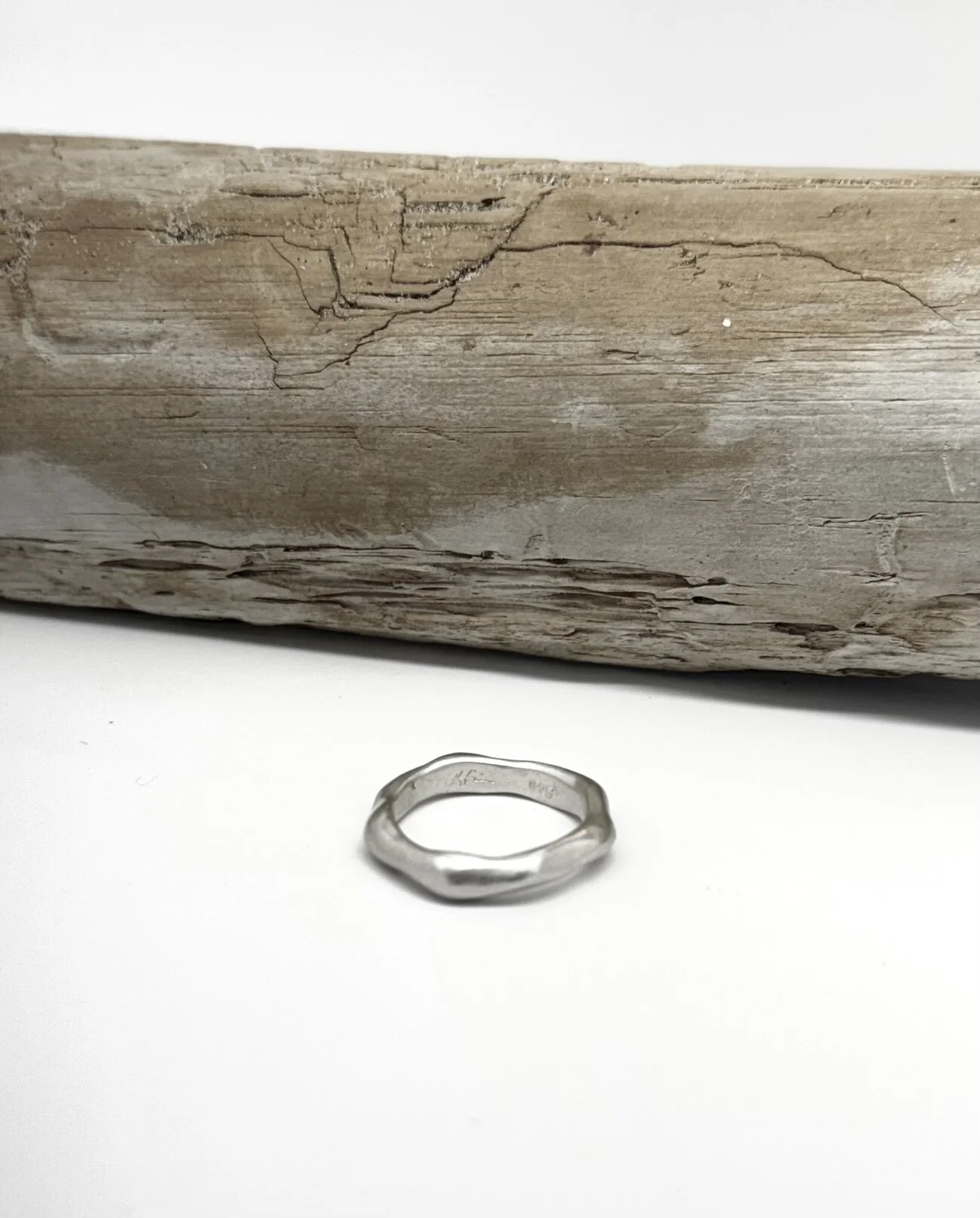 Modern organic band ring in sterling silver, handmade with fluid natural lines