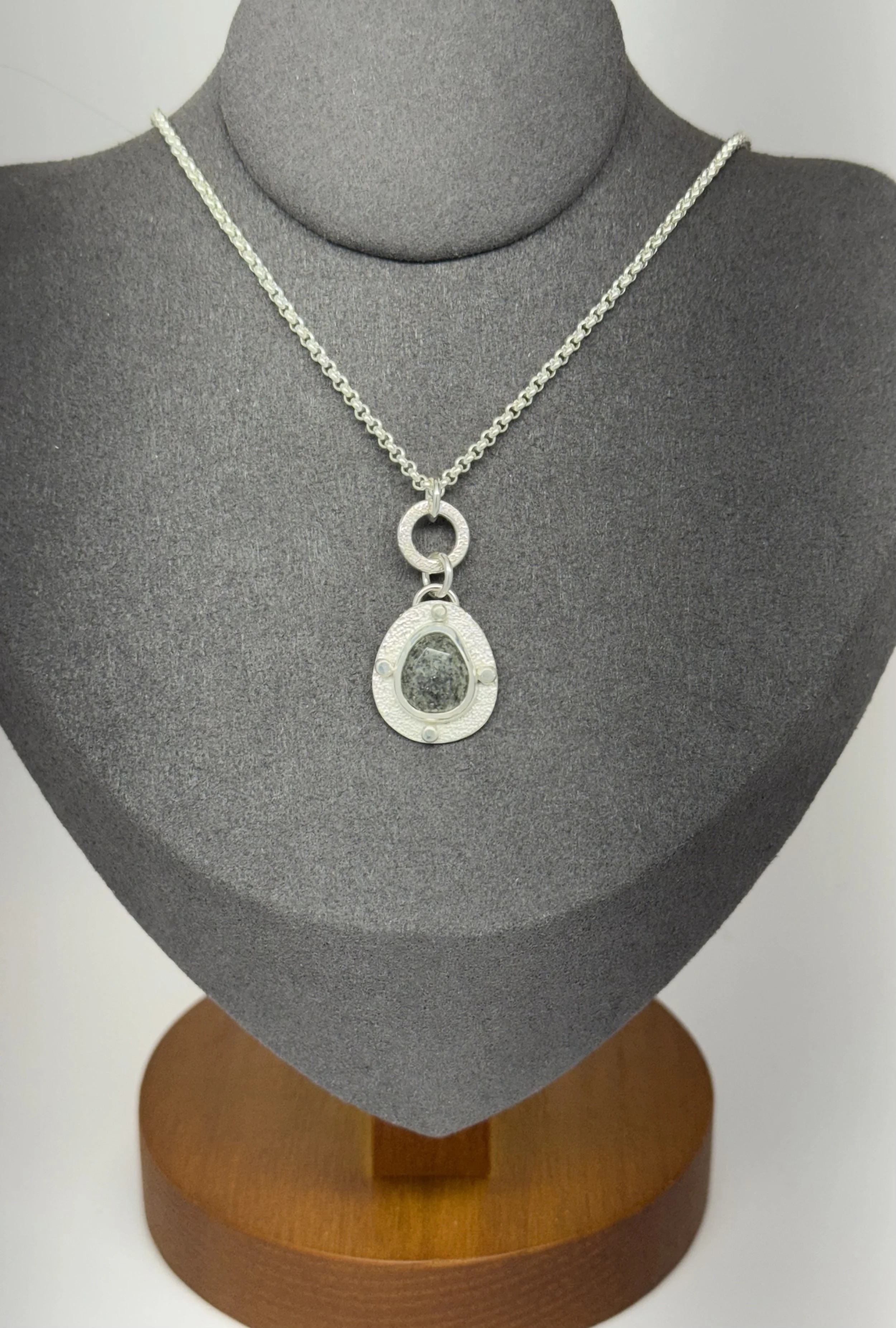 Modern Relic Pendant black aventurine on gray stand closeup.jpg