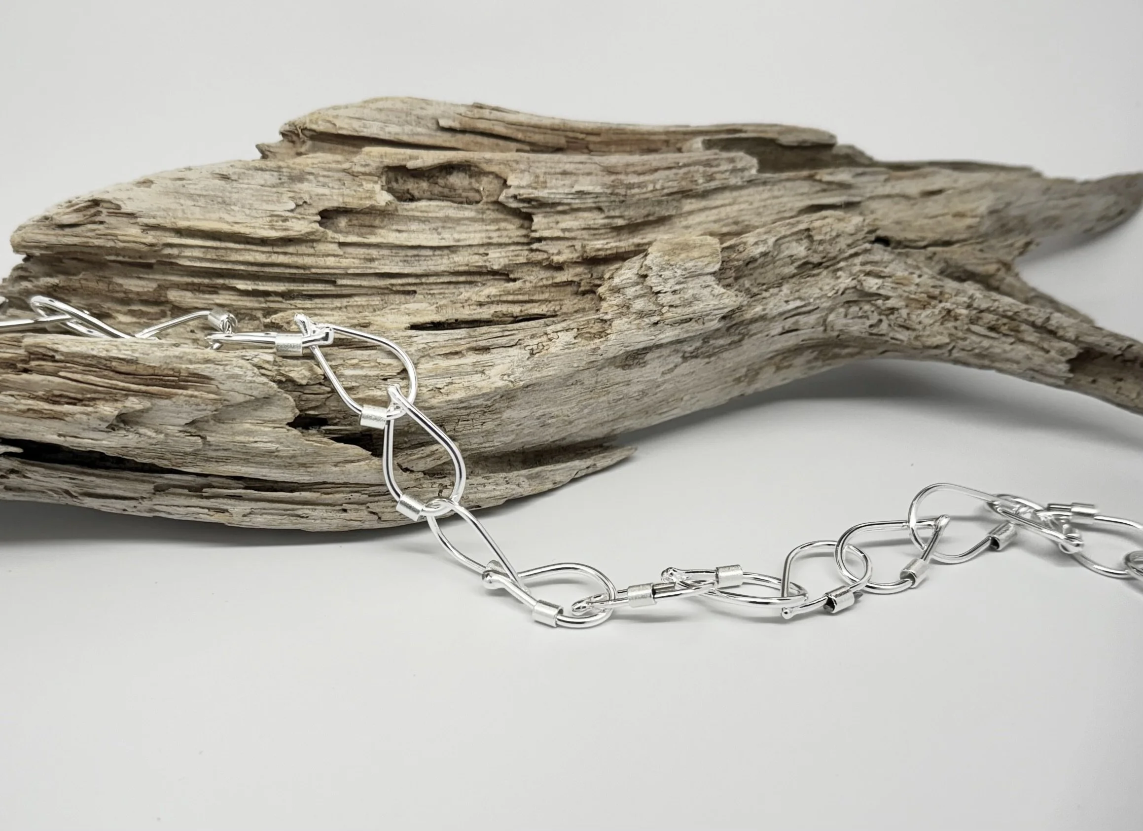 Minimal modern Droplet Link Necklace in sterling silver with interlocking organic droplet links, artisan handcrafted design