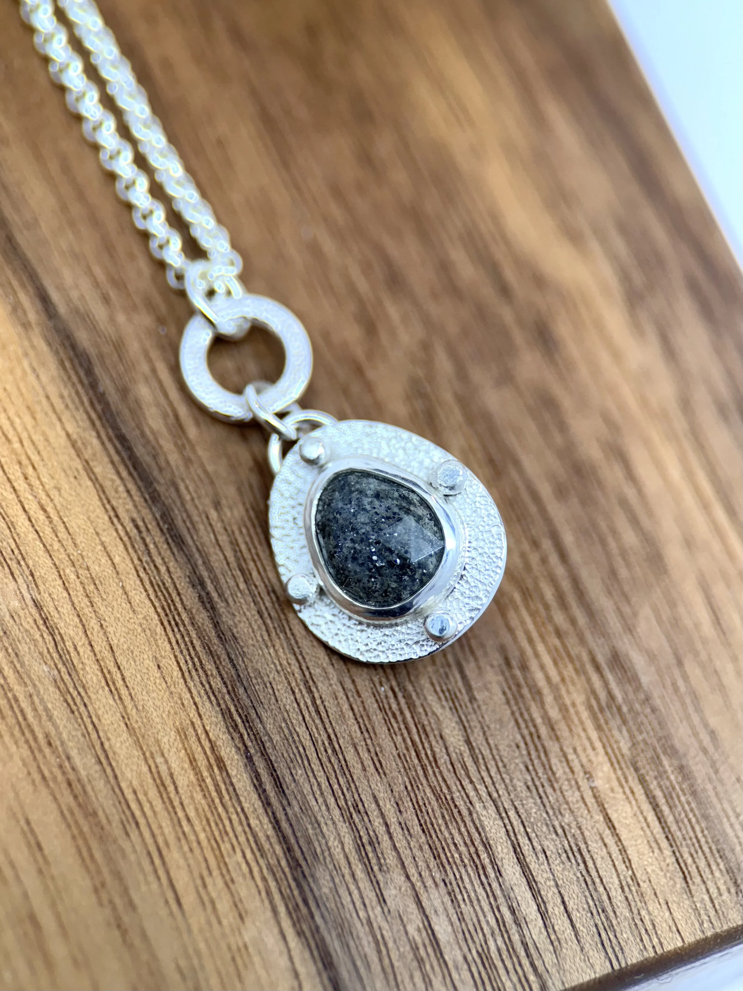 Modern Relic Pendant black aventurine closeup on wood.jpg
