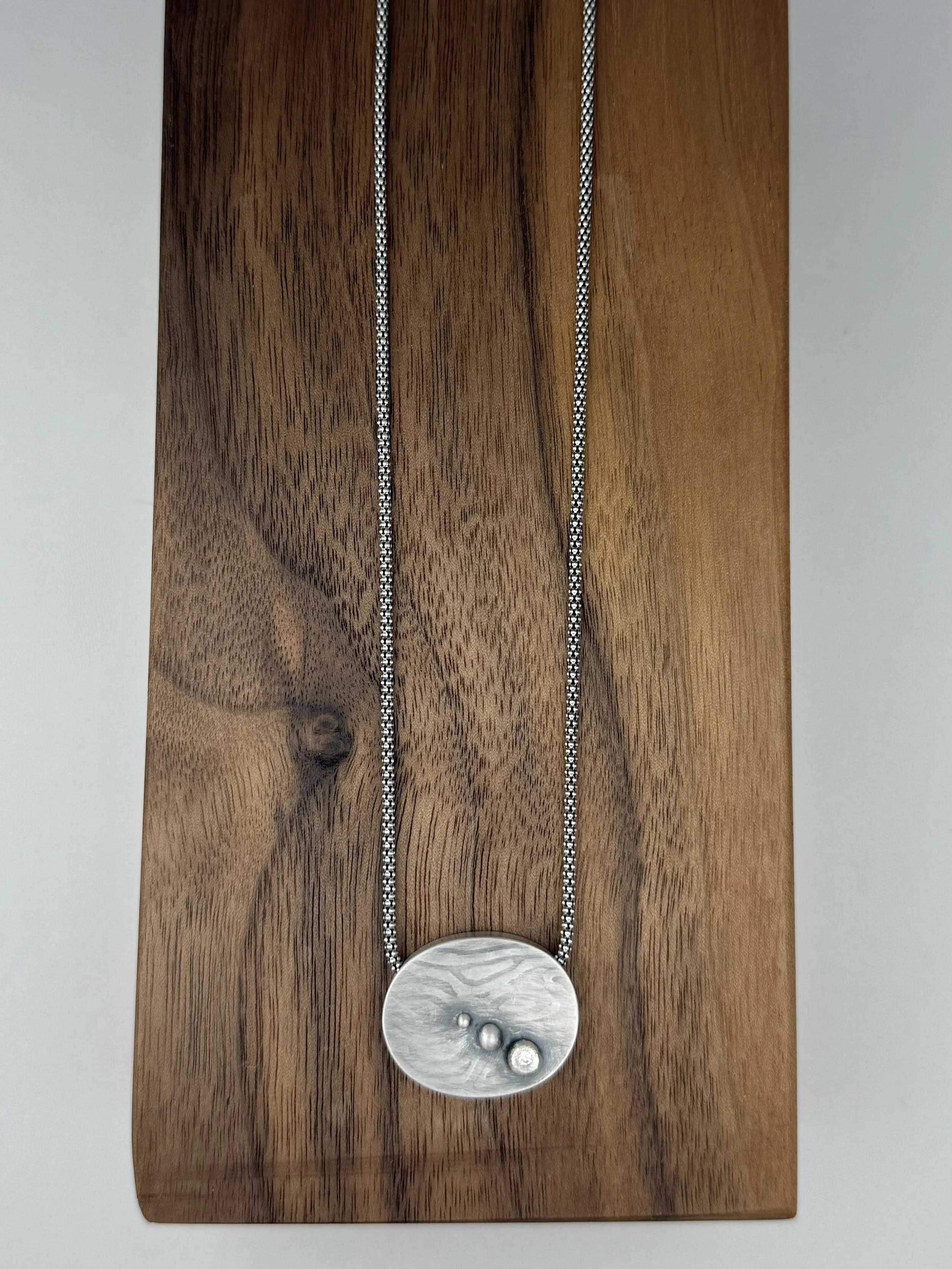Harbor Light pendant lying flat on wood.jpg