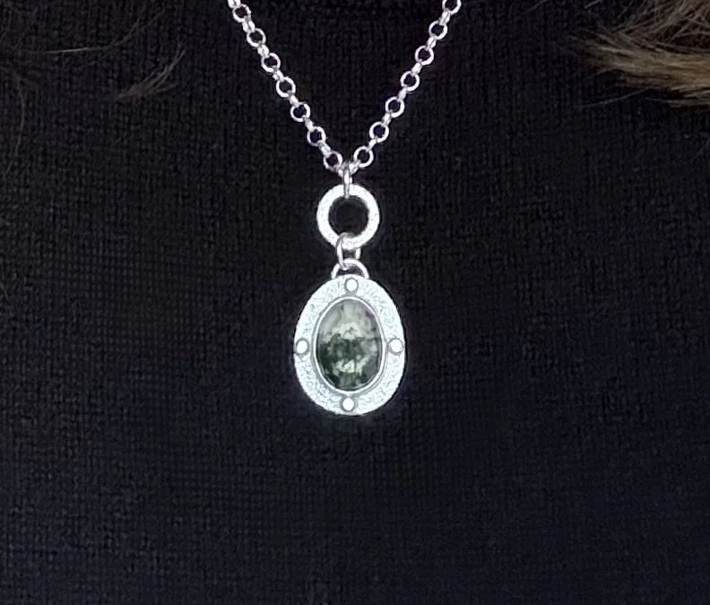Modern Relic Pendant moss agate worn close up.jpg