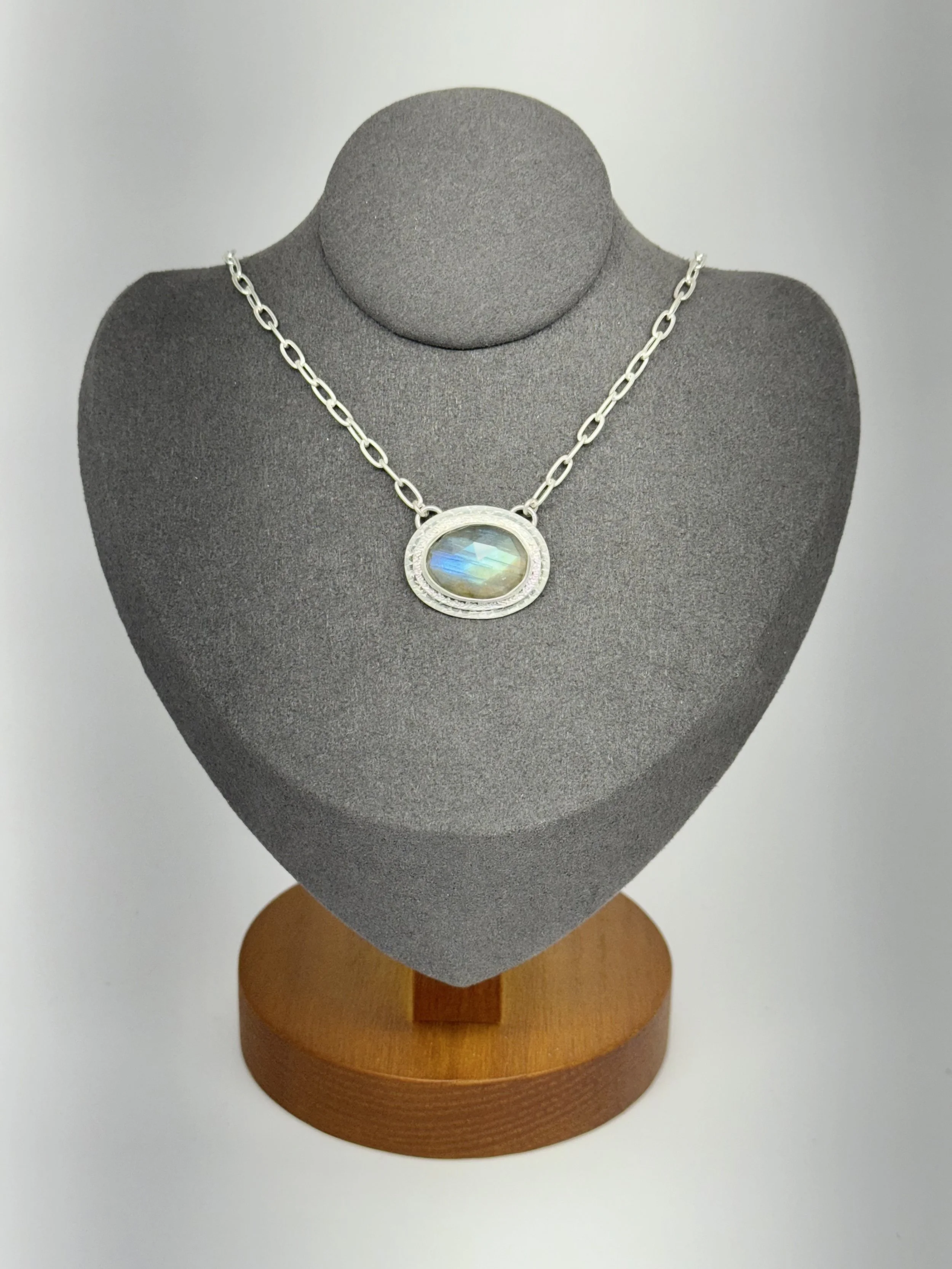 Portal Pendant Labradorite on gray stand.jpg