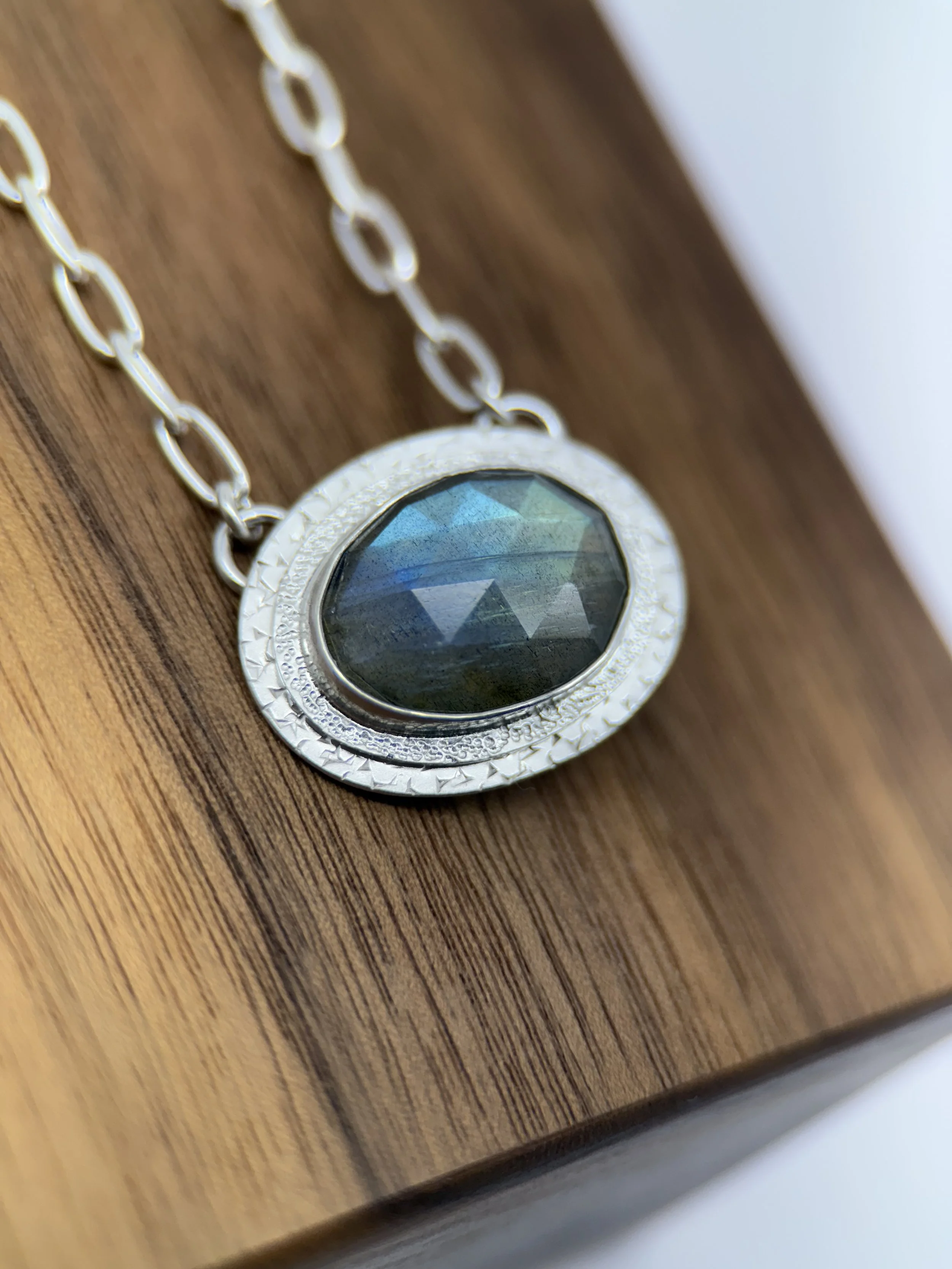 Portal Pendant Labradorite closeup on wood.jpg