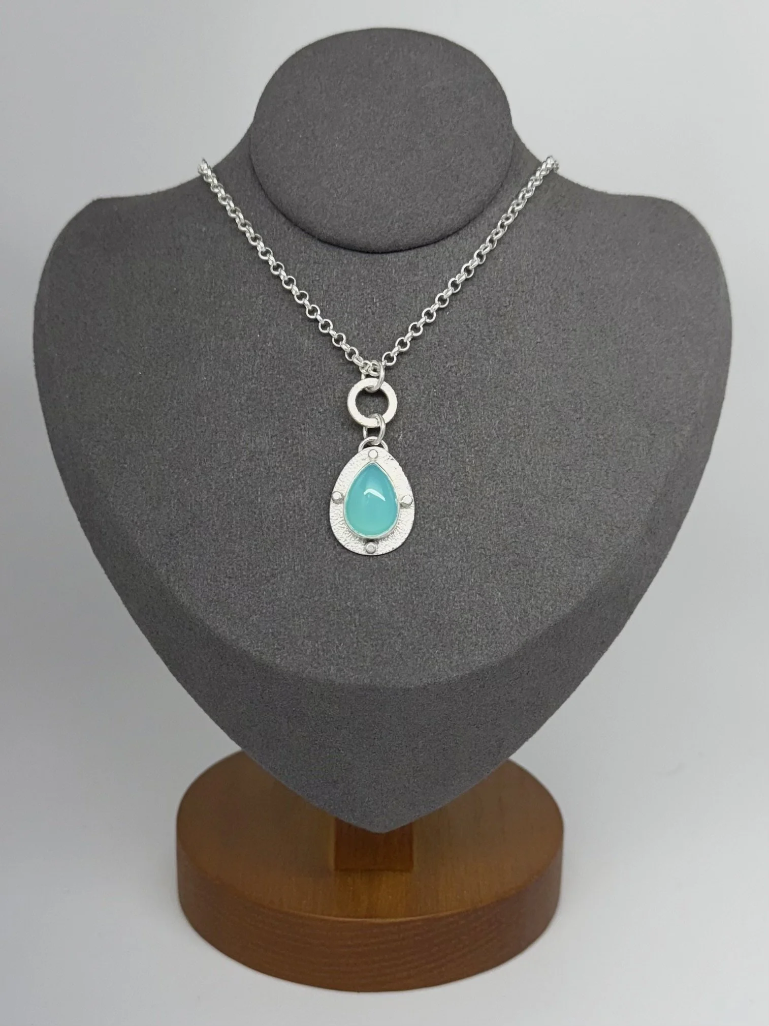 Modern Relic Blue Chalcedony pendant on gray stand.jpg