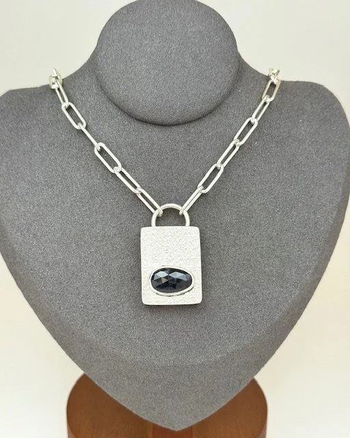 Keyston necklace blue sapphire on stand.jpg