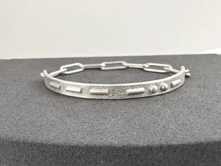 Love Note Bracelet front view on gray platform.jpeg