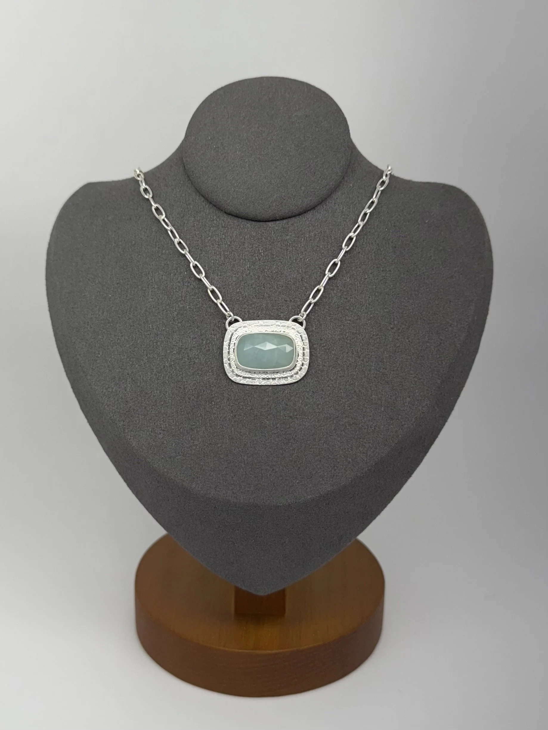 Portal Pendant Aquamarine on gray stand.jpg