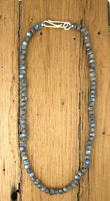 Heirloom Labradorite lying flat on wood.jpeg