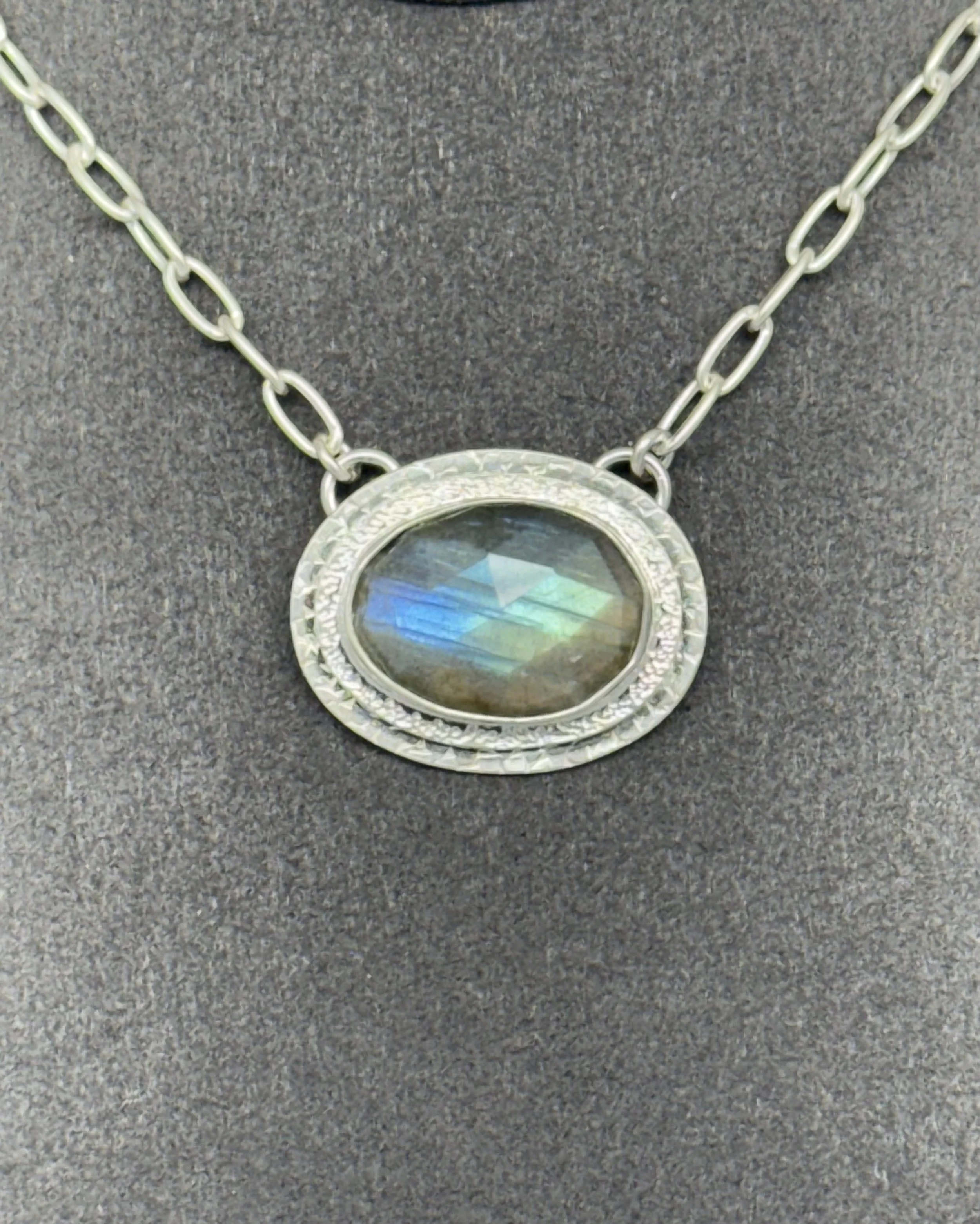 Portal Pendant Labradorite closeup on gray stand.jpg