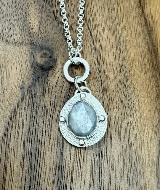 Modern Relic Silver Sapphire close up on wood.jpg