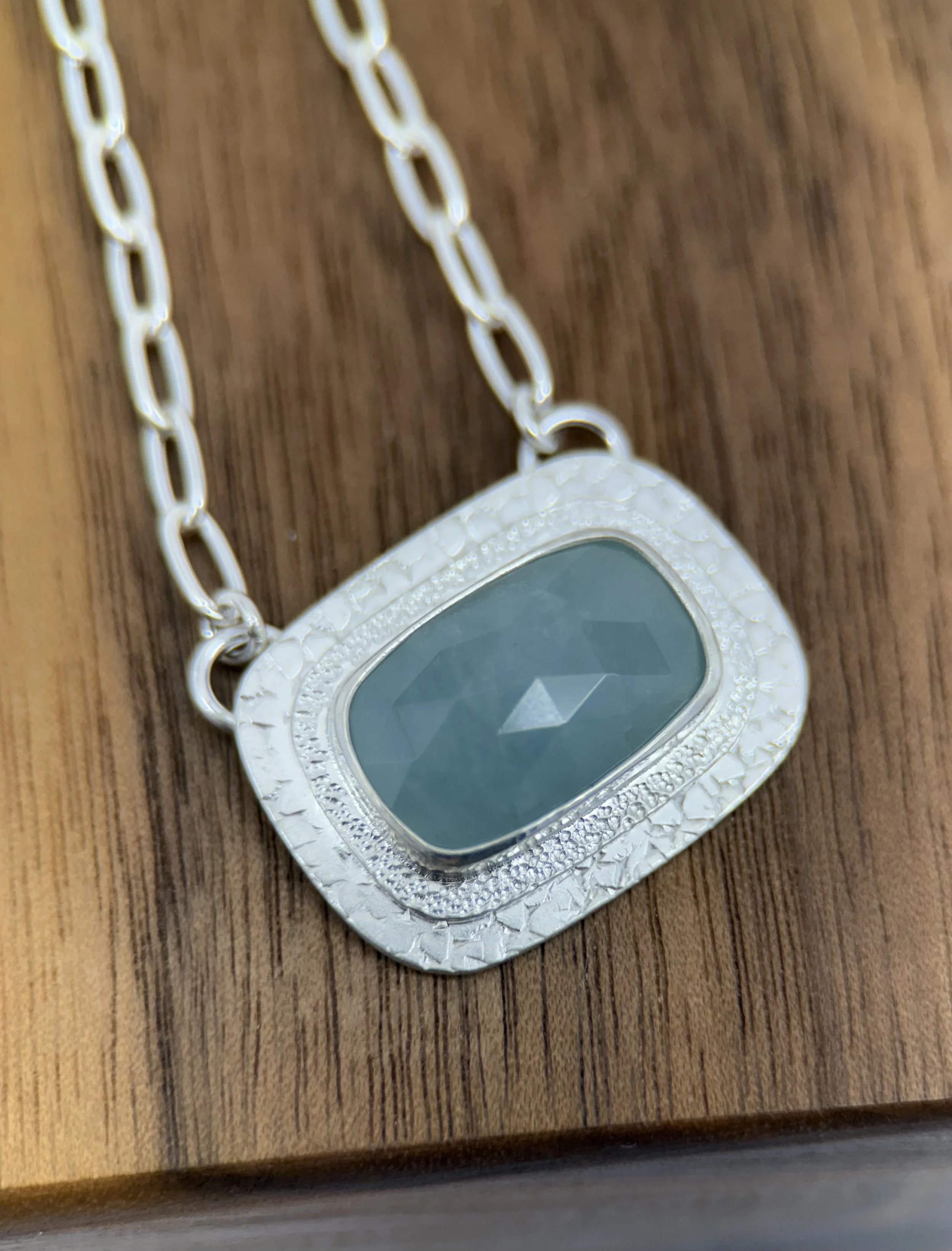 Portal Pendant Aquamarine close up on wood.jpg