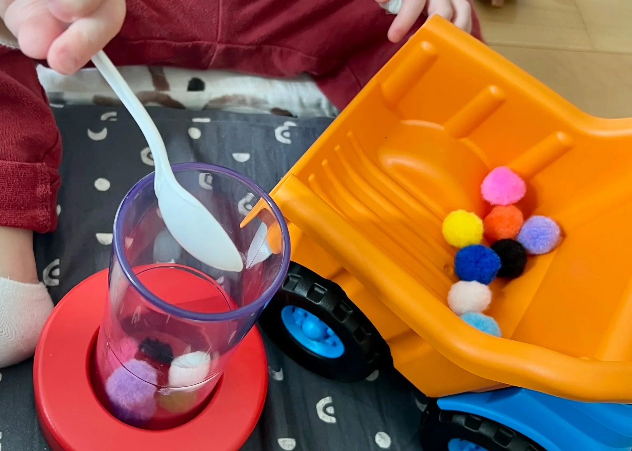 Pediatric speech-language pathologist working with a toddler on communication skills in NYC