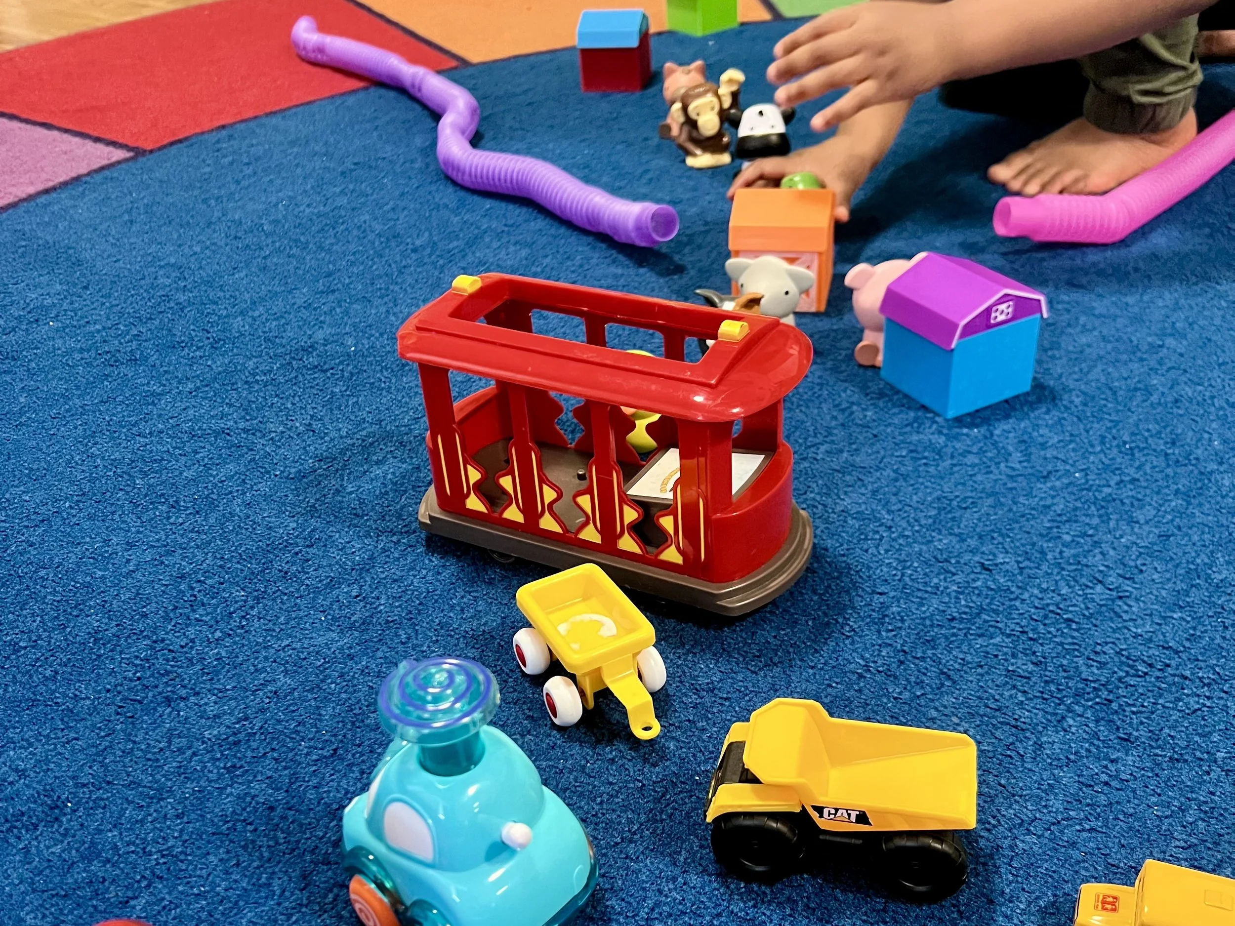 Speech therapist using play-based activities with a young child during an in-home session in Brooklyn