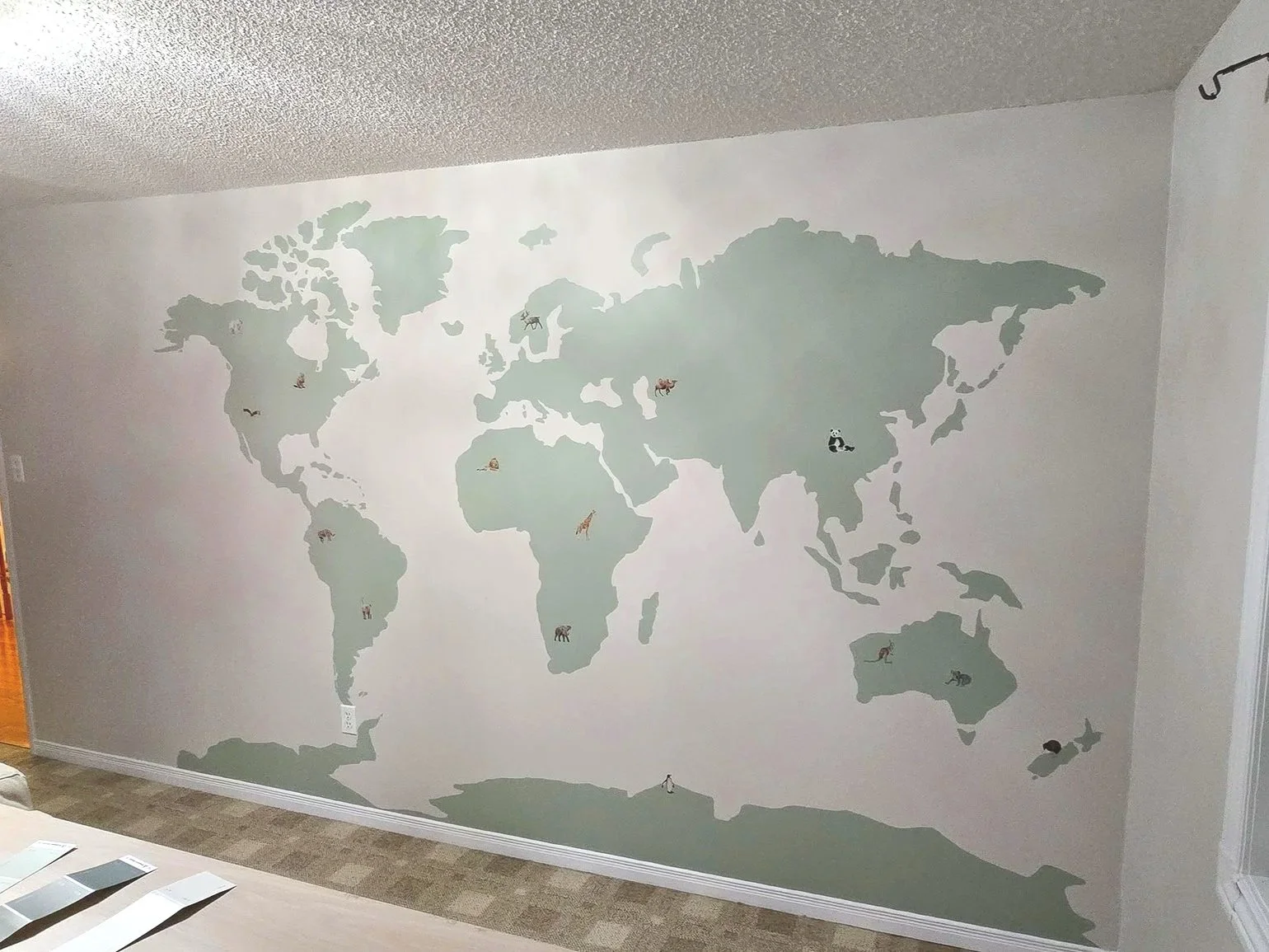 This nursery mural will remain age appropriate for many years thanks to the design choice of painting the animals in a more realistic style.