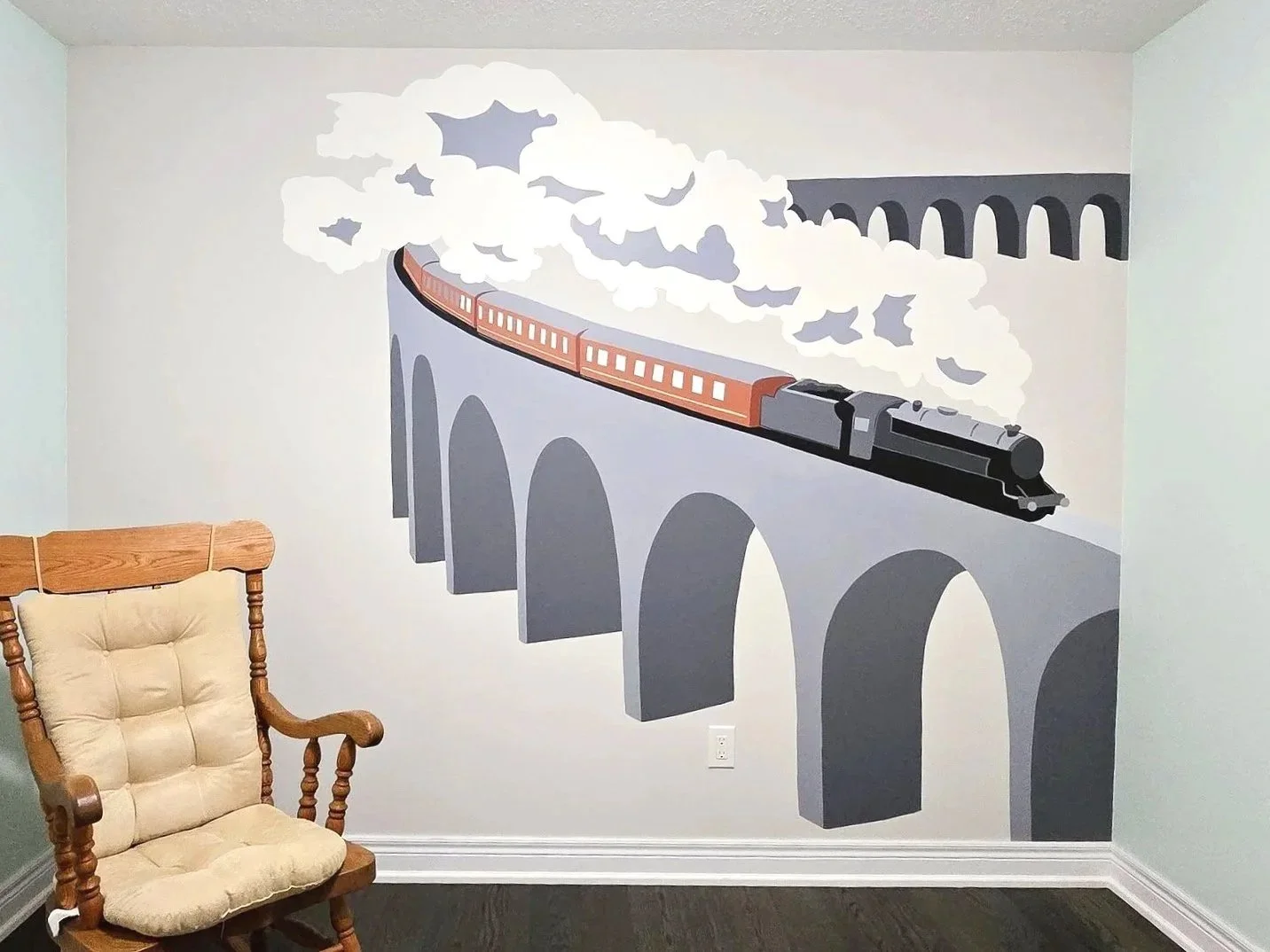 How to design a nursery with a Harry Potter feel without going over the top? This dialled back Hogwarts Express train is the perfect mural for the space. 