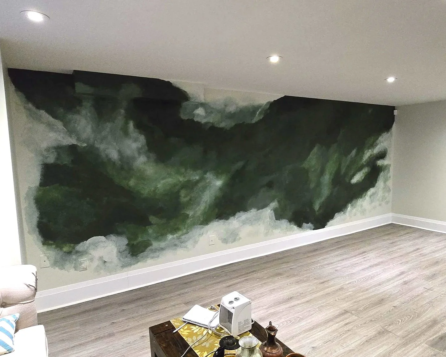 We transformed this basement office to a luxurious, wall-to-wall piece of abstract art. The abstract mural elevates the space, and has the added bonus of disguising the duct work and wall outlets.