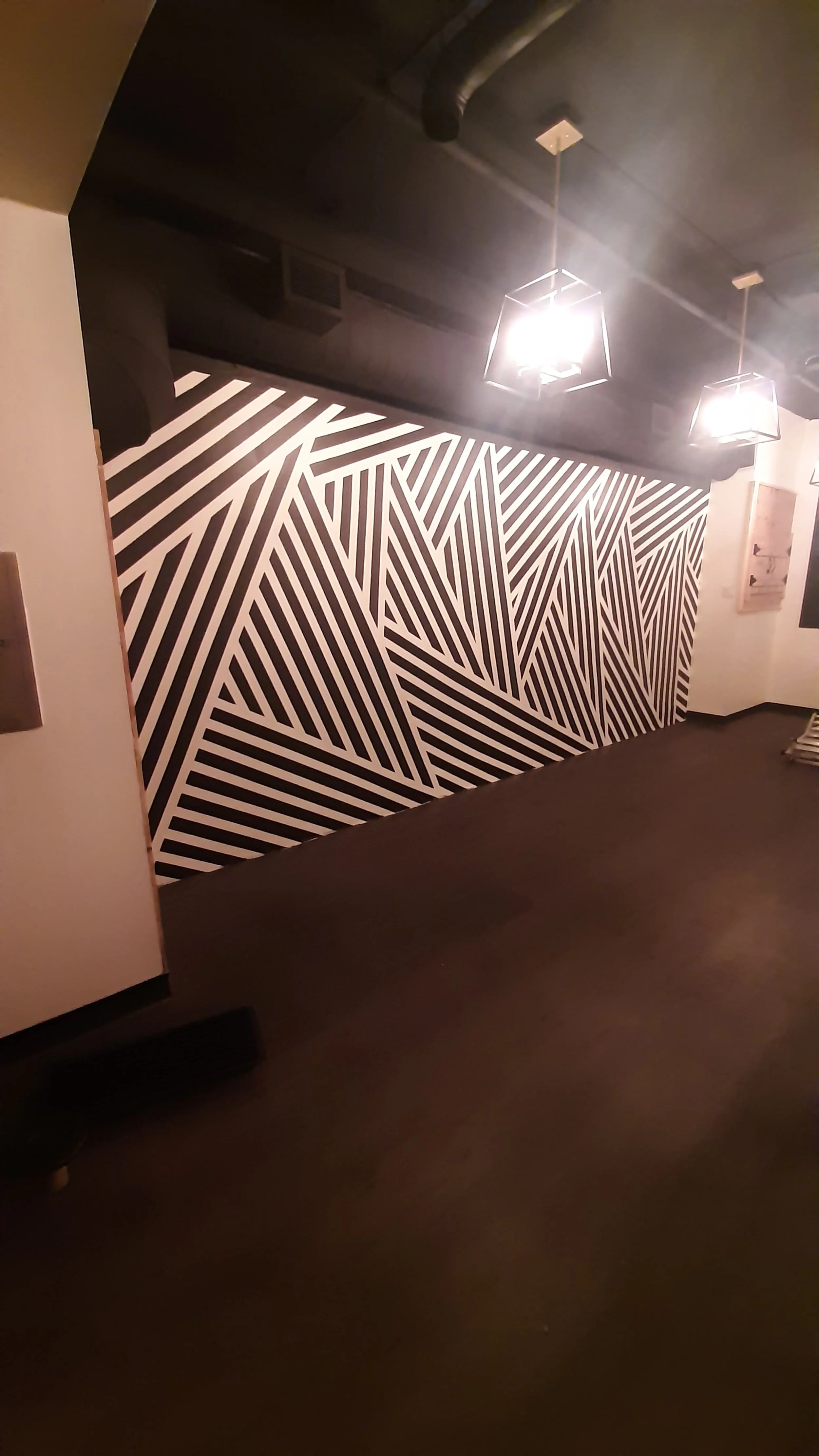 This bold striped design was drawn up by the client and brought to life in this multi-purpose room.