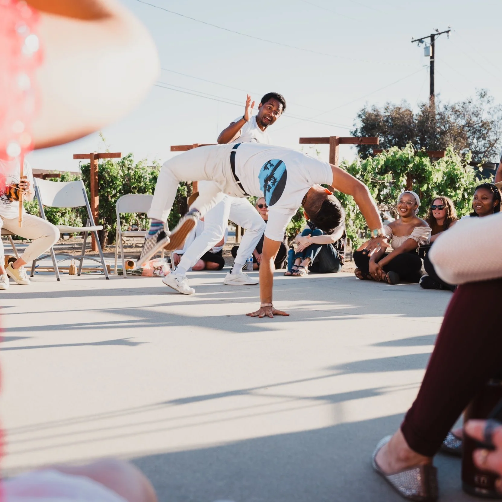 Nico Zuluaga and Brian Shields of Kapoeira N'gola Preto Velho play a game of Capoeira de Angola